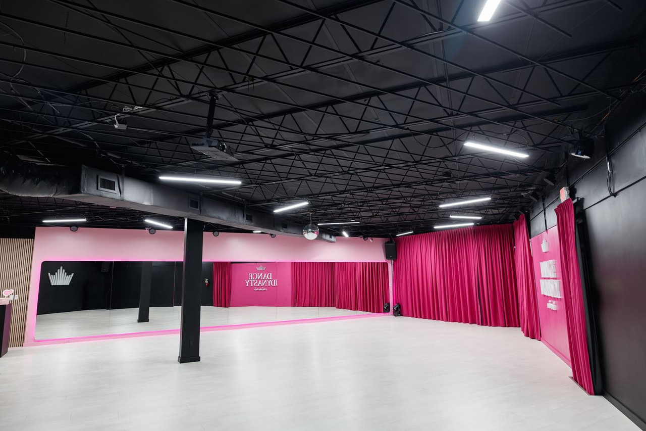 Main hall with mirrors and stage curtains