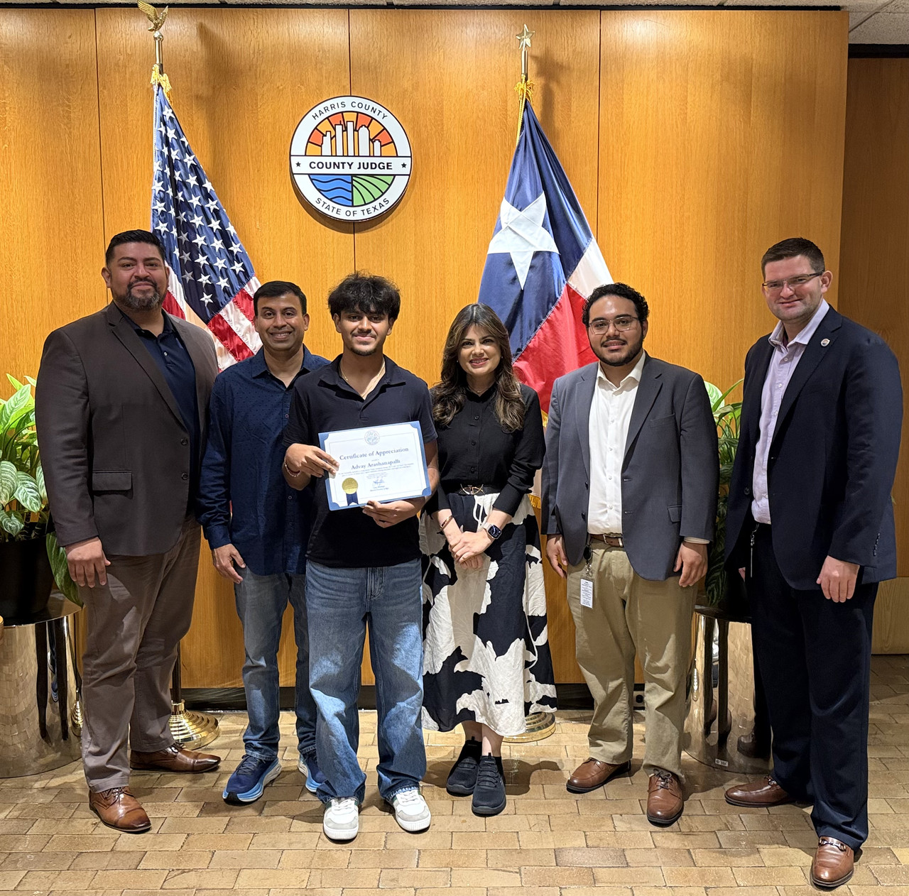Harris County Judge Lina Hidalgo presenting a Certificate of Appreciation to ORAI founder Advay Arashanapalli.