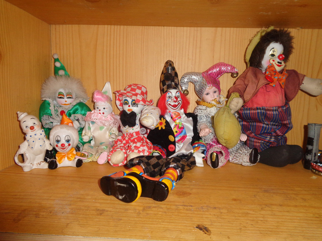 A photo of several porcelain clowns.