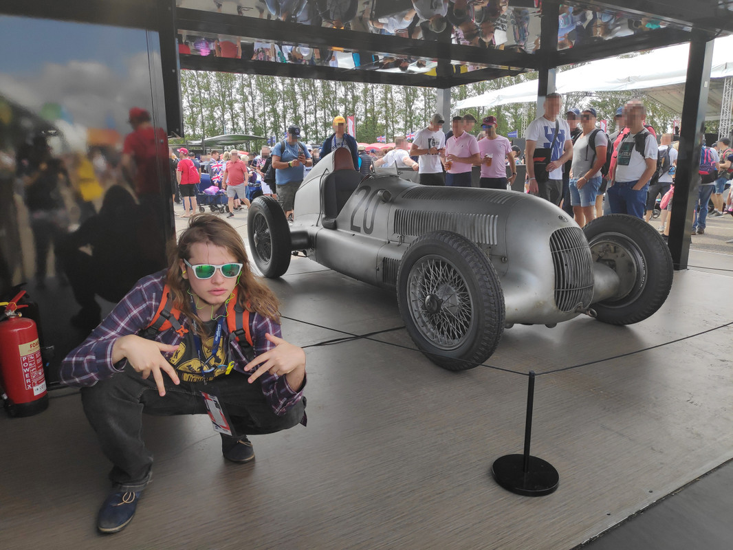 Chris posing in front of a classic Mercedes car
