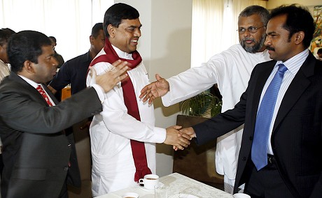 senior-presidential-advisor-basil-rajapaksa-2-l-congratulates-440nw-7862690a.jpg