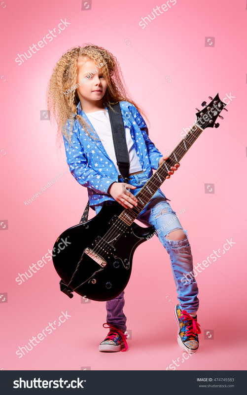 stock-photo-modern-seven-year-old-girl-with-her-electric-guitar-
