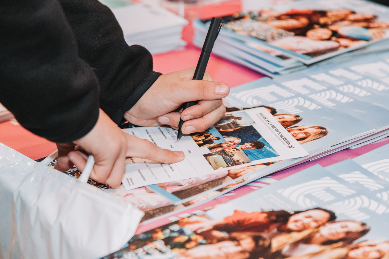 A person holding a credential at an event.