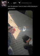 Nari showing off his glasses with visible vapes in the background.