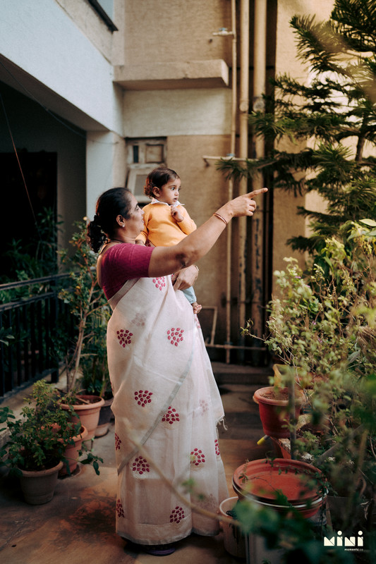 South Indian family photographer Rugby — candid home portrait, natural window light