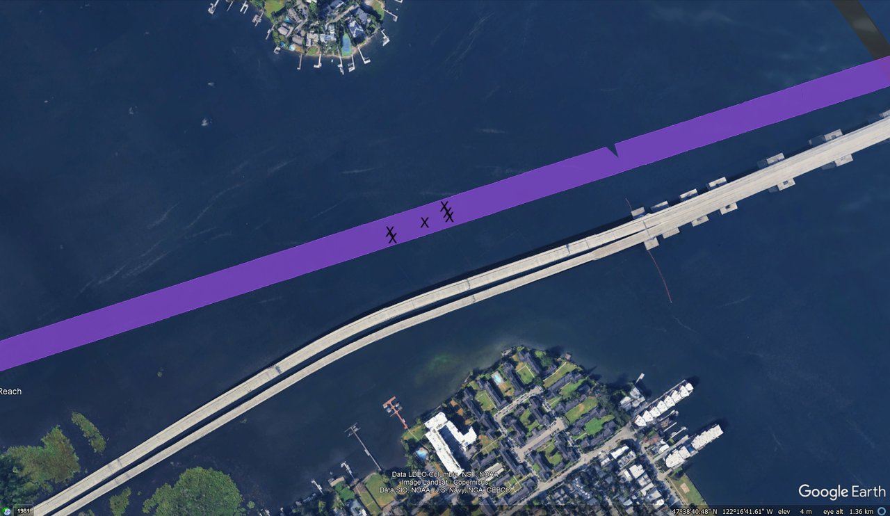 A google earth screenshot of lake washington. Six x's mark the location of defenders on the lake.