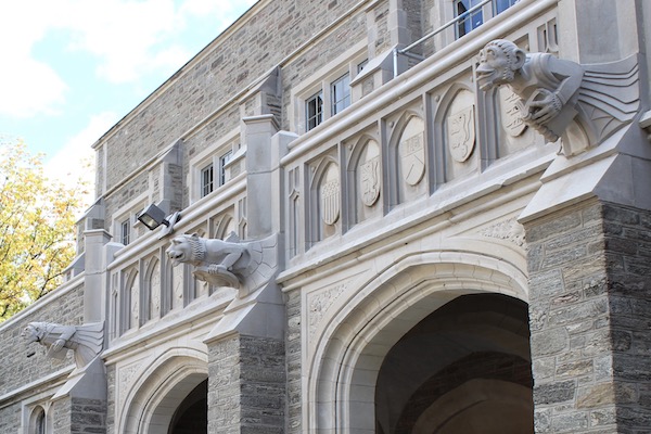 Four stone gargoyles on the exterior of Dillon gym