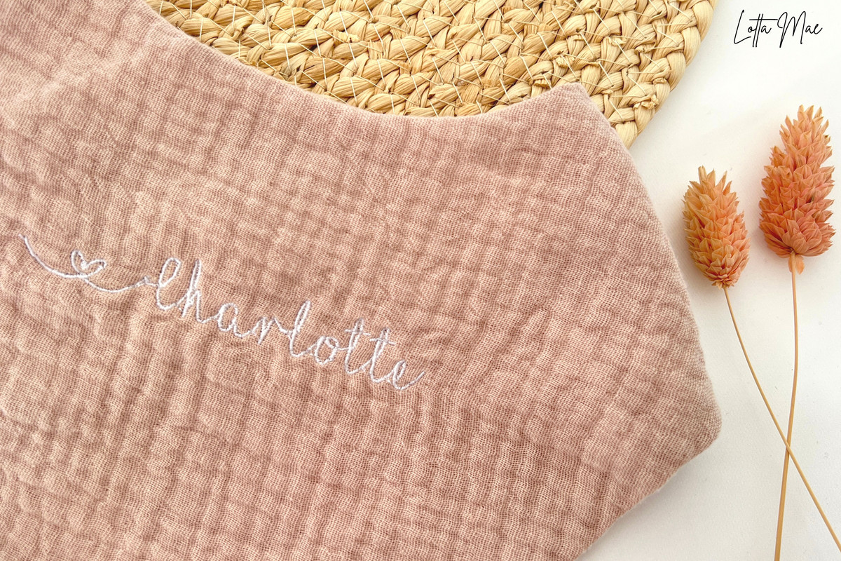 This baby bib is perfect for your little one! Made from 100% cotton, it’s soft and comfortable against delicate skin. It can be embroidered with a name or word of your choice in a variety of fonts and colors to create a personalized look. Plus, the snap buttons make it easy to put on and take off - no more struggling with ties! It’s perfect for everyday use, or an extra special occasion. 
Keep your baby clean and looking great in this stylish bib. Get yours today!