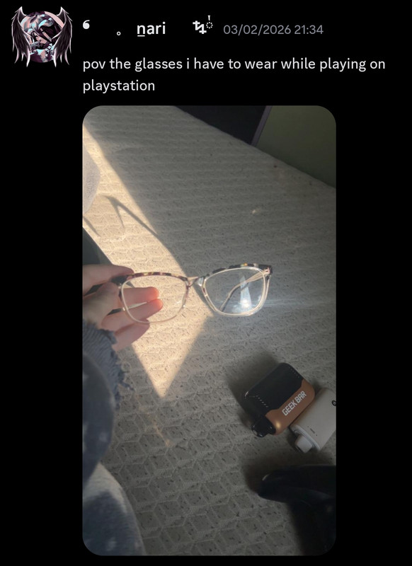 Nari showing off his glasses with visible vapes in the background.