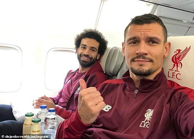 4695740-6230969-_Salah_and_Lovren_sit_next_to_each_other_on_the_f