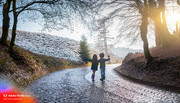 Firefly-magical-road-with-curves-representing-a-personal-journey-with-wet-ground-made-of-cobbleston