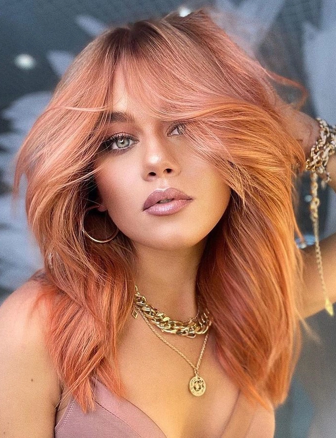 Light strawberry color hair with long bangs