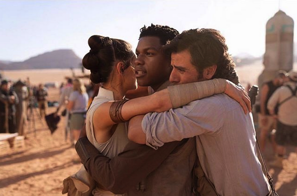 image of Daisy Ridley, John Boyega, and Oscar Isaac hugging