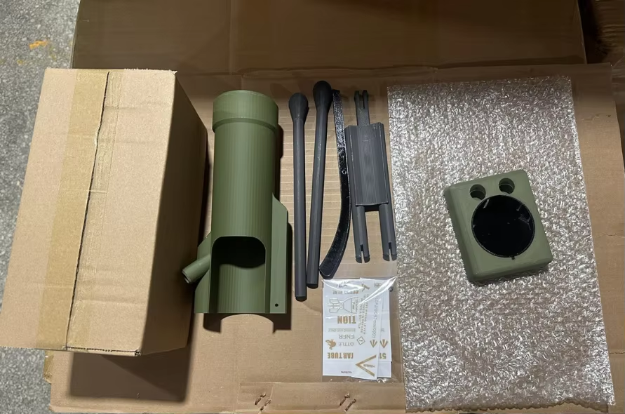 Beer Cap Launcher components inside premium packaging