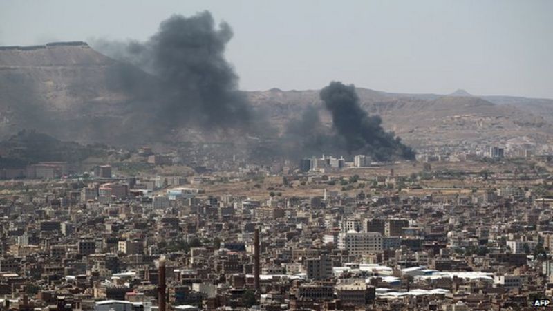 Smoke-rises-from-the-main-gate-of-a-government-military-base-during-an-attack-by-Houthi-rebels.jpg