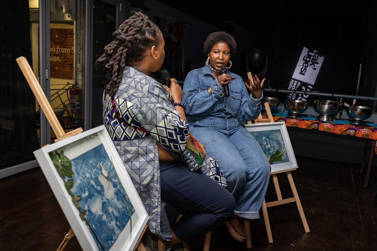 Samukelisiwe Dube being interviewed on stage.