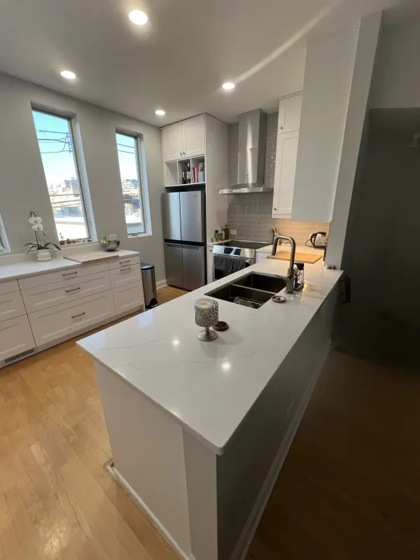 Kitchen renovation with modern lighting and open shelving