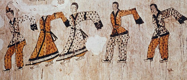 Original dancer costumes of five dancers in a row waving their long sleeves.
