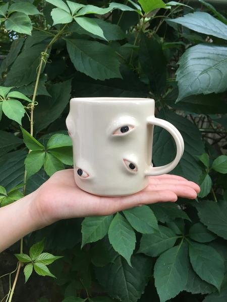 mug with lots of eyes