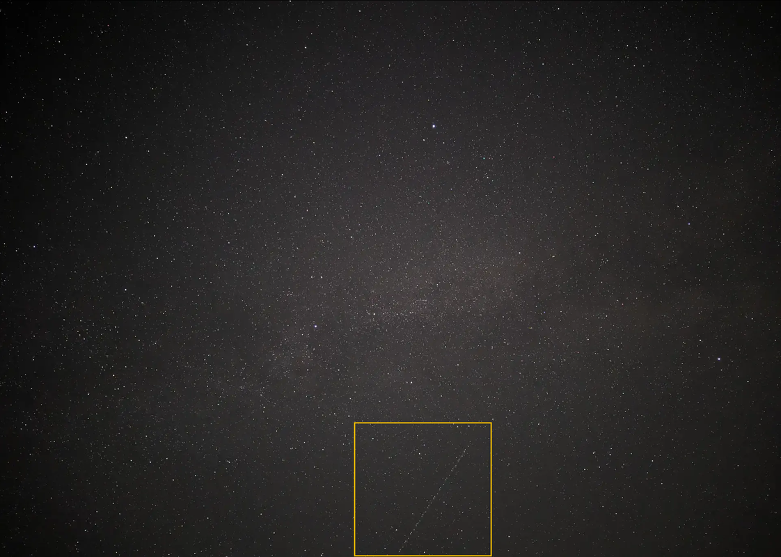screenshot of original picture with orange box around line artifact at just right of center at bottom