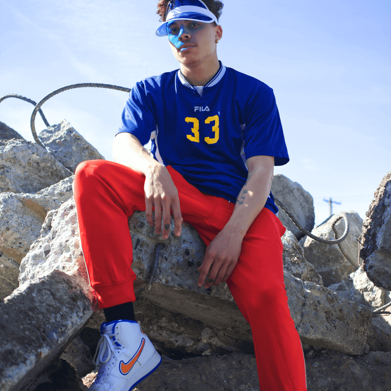 man sitting on a rock