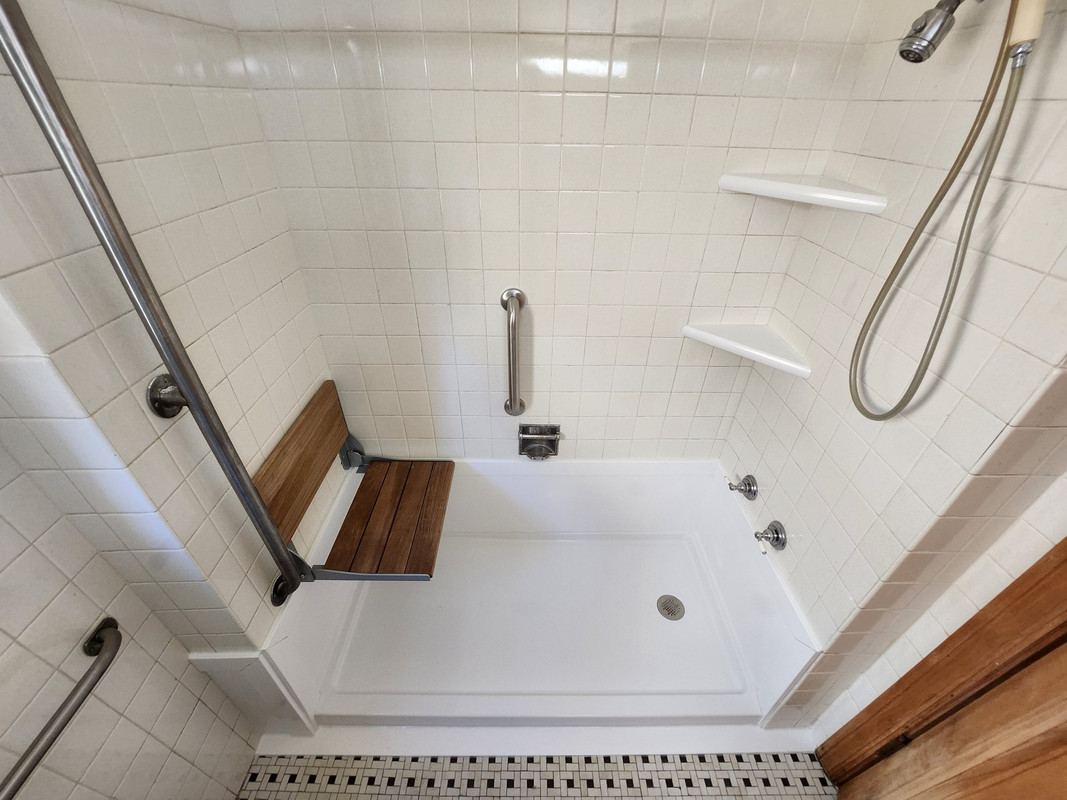 Albuquerque plumber finishing bathtub installation with cleanup