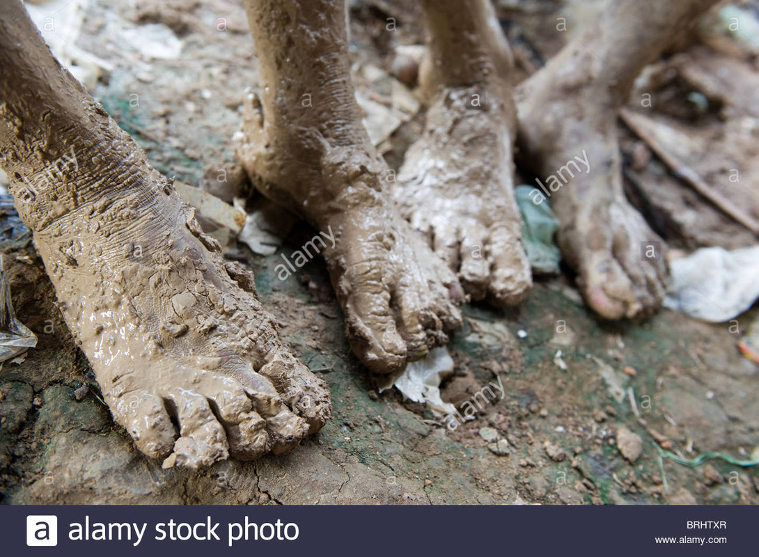 https://i.postimg.cc/hvX00BCz/muddy-feet-from-clay-at-the-brickworks-in-kampong-thom-in-cambodia-BRHTXR.jpg