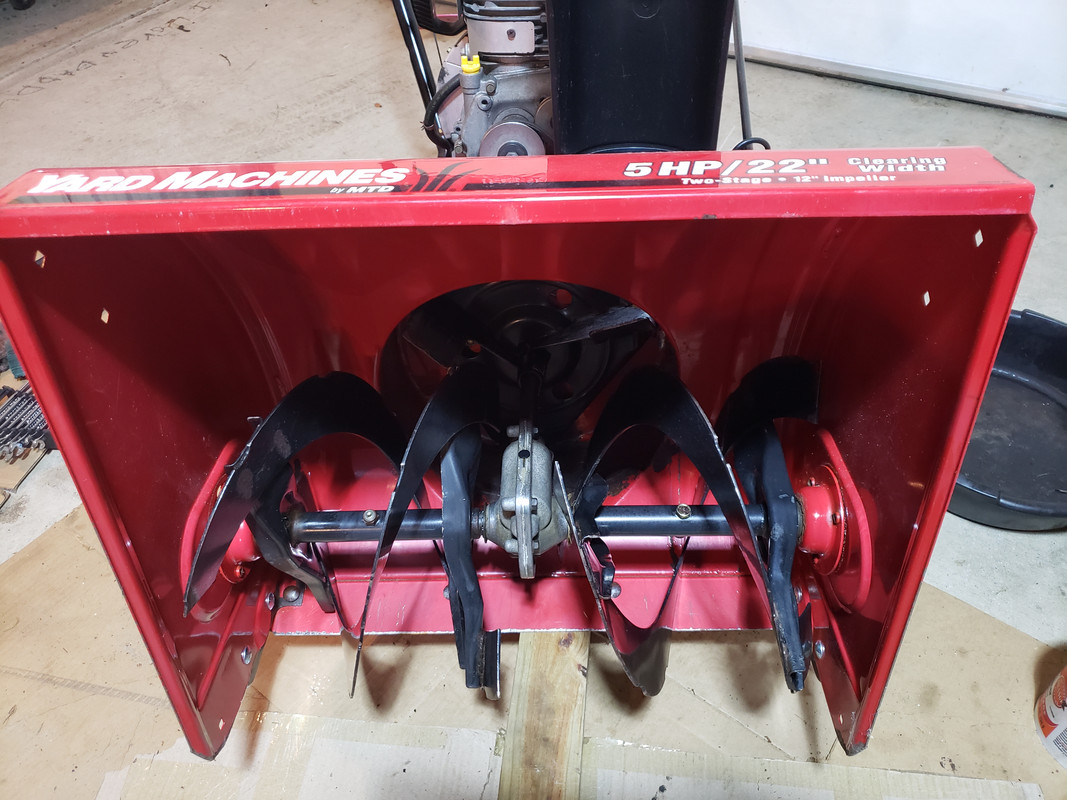 How do I get the auger paddles removed from my snowblower? With pic....