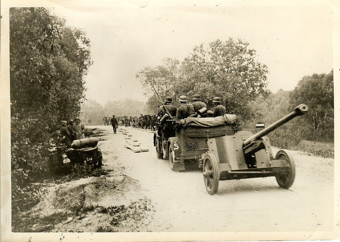 Motorised Wehrmacht Panzerjägers Passing on Road w PAK 38 5cm Gun