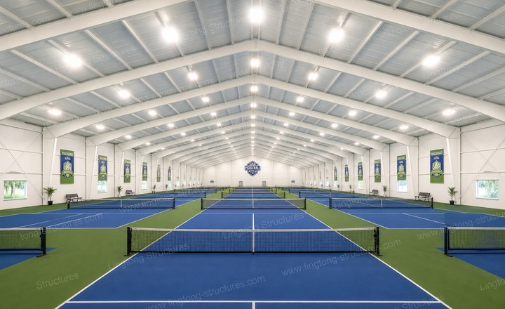 Interior of LINGTONG pickleball tent showing multiple courts and professional lighting