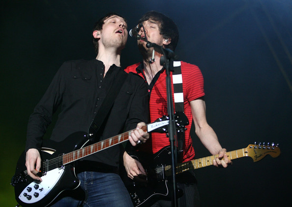 Gary with the member of Snow Patrol performing on a concert