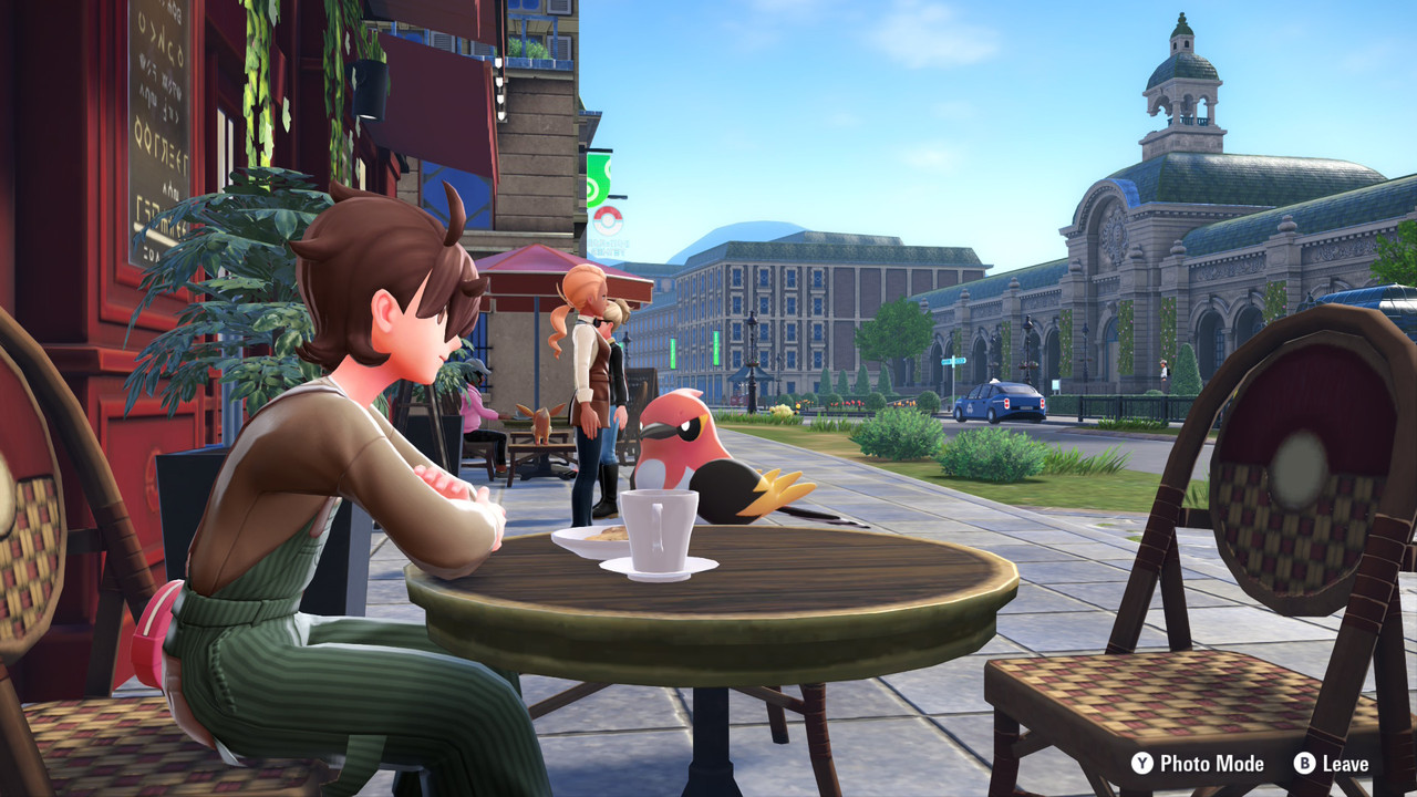 Tyler sitting with Fletchinder at a café in Lumiose.