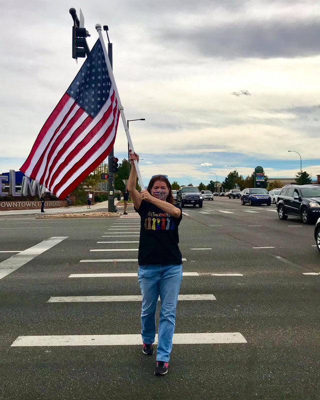 Woman holding flag 10 17 20