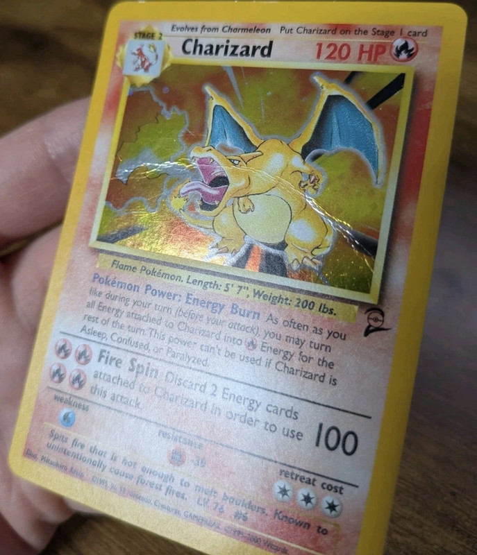 Base Set Charizard Pokémon card with foil haze before restoration