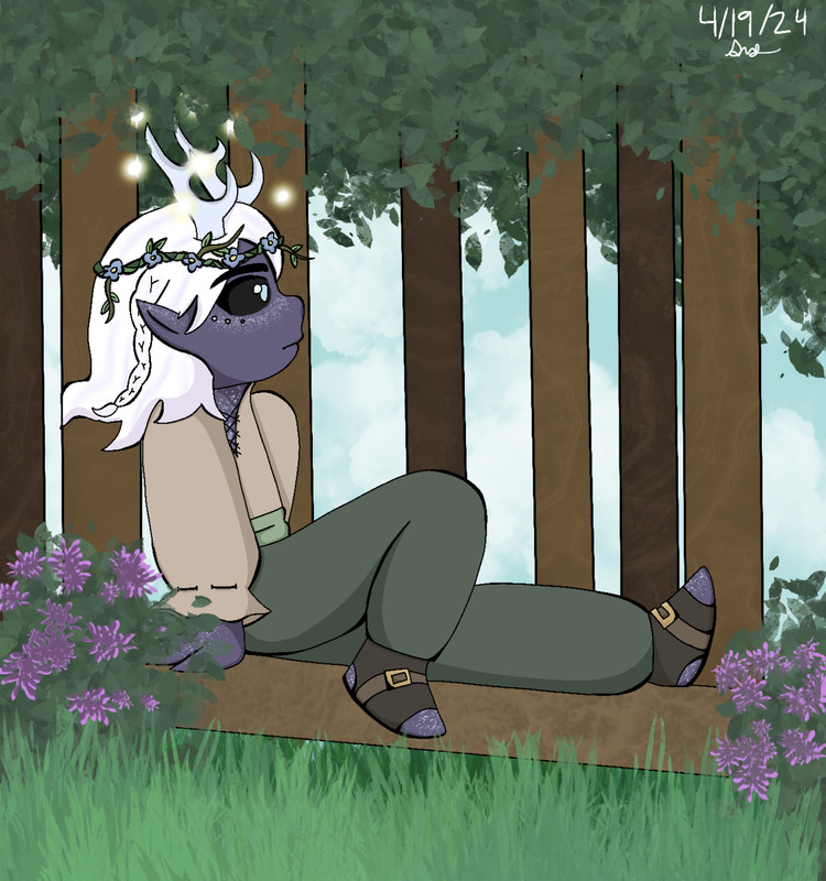 young Asmund sitting on a fallen tree