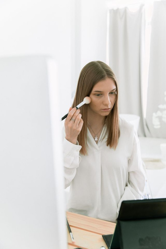 woman doing skincare before makeup so her foundation makeup looks smooth and flawless 