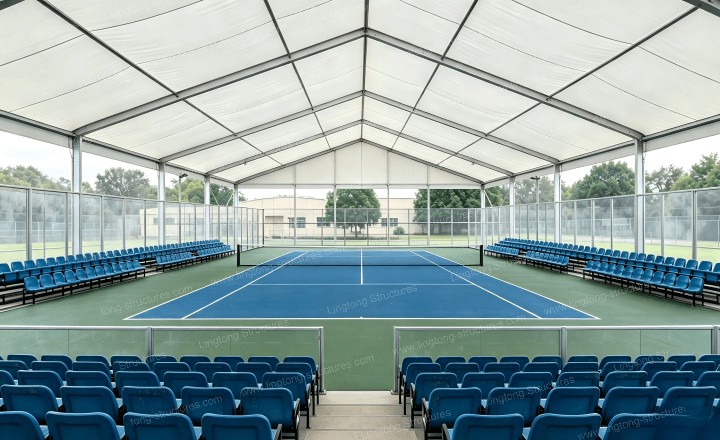 Padel court tent interior showing clear span and transparent sidewalls for optimal play visibility