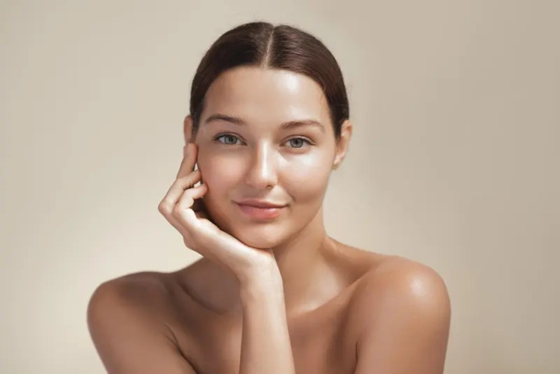 Person with naturally glowing and healthy skin in natural light