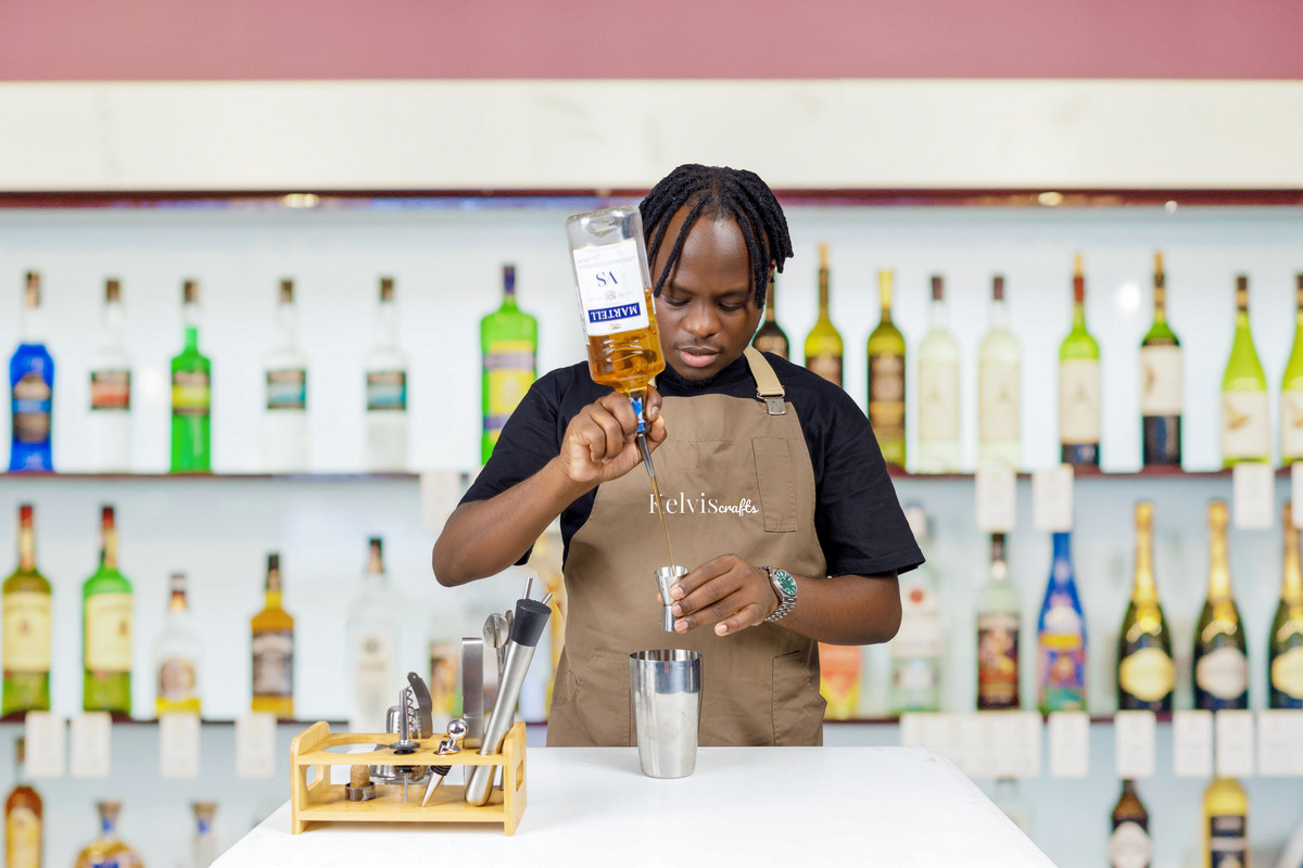 KelvisCrafts Pouring Martell Inside a Jigger.