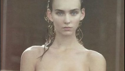 A Sexy, Girl Sitting Completely Naked, Showing Her Boobs While Something Comes Out Of Her Mouth.