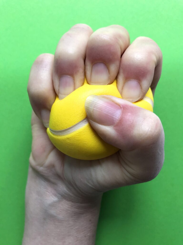 stress-relief-stress-ball-in-a-clenched-fist-2JE9A3C-min-768x1024