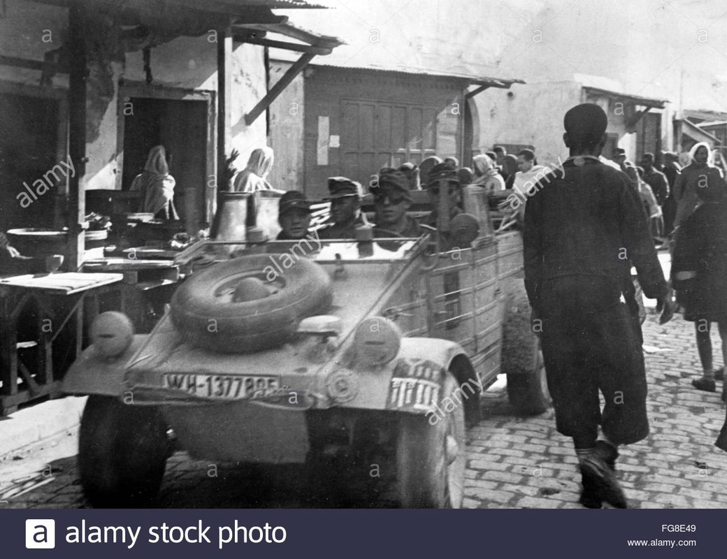 picture shows soldiers of the German Wehrmacht in a Volkswagen Type 83 (Kuebelwagen) in the occupied