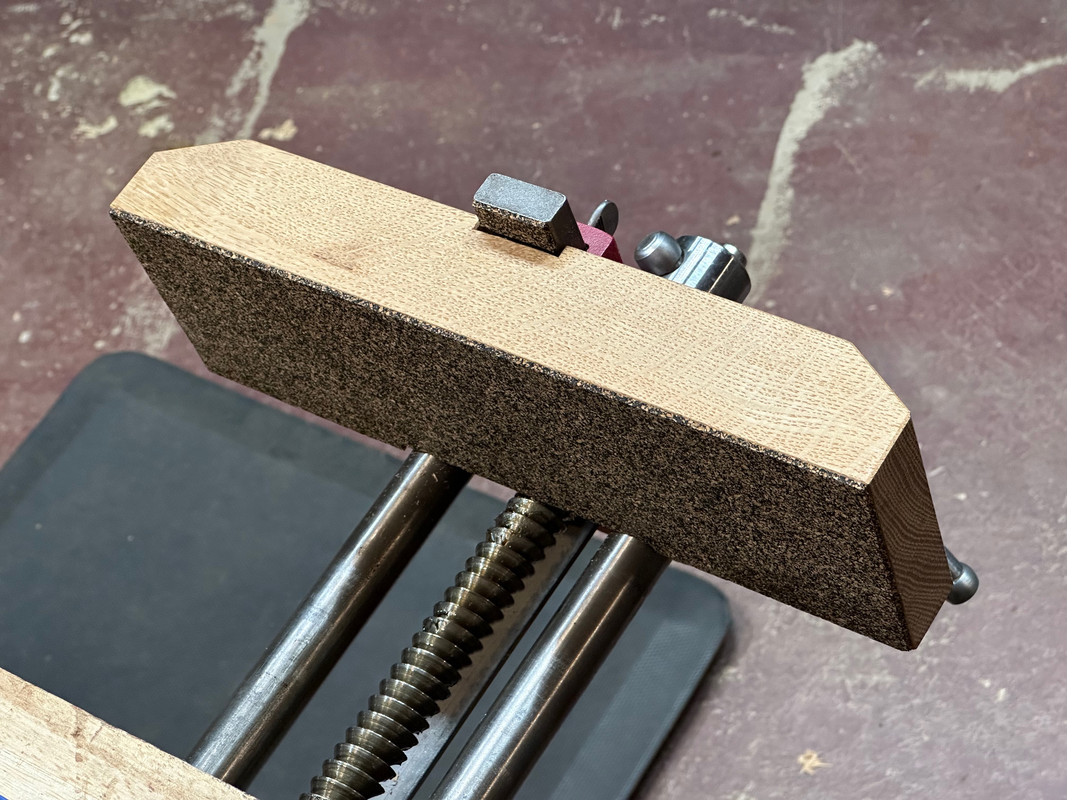 Crubber on the jaw face and dog for grip and to limit marring.