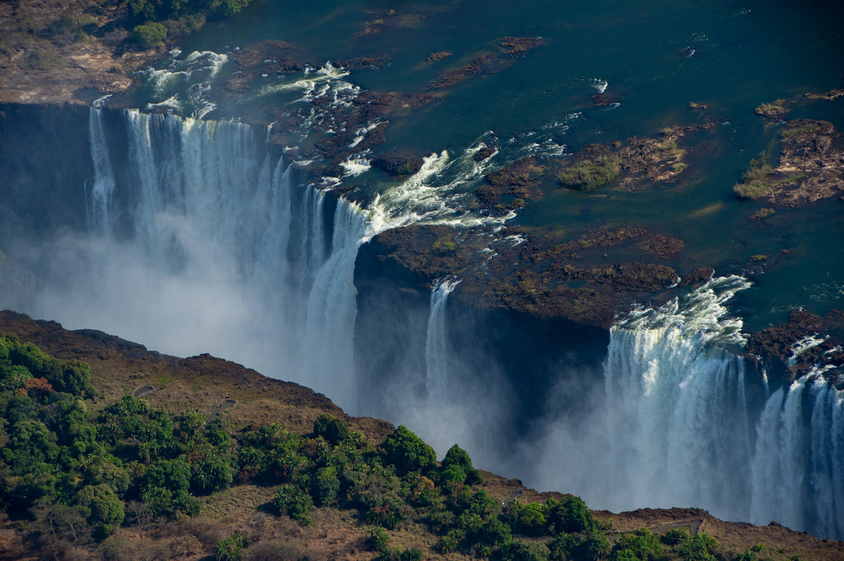 Aerial panorama of Victoria Falls with rainbow mist