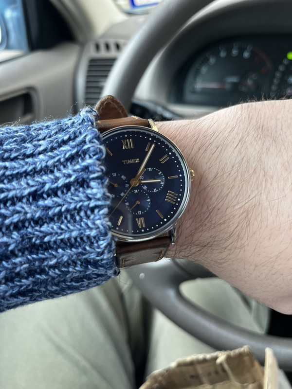 my watch, a blue and gold Timex with a brown strap