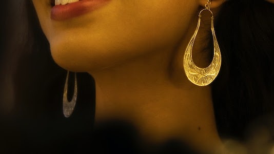 An image of a girl showoffing her earring