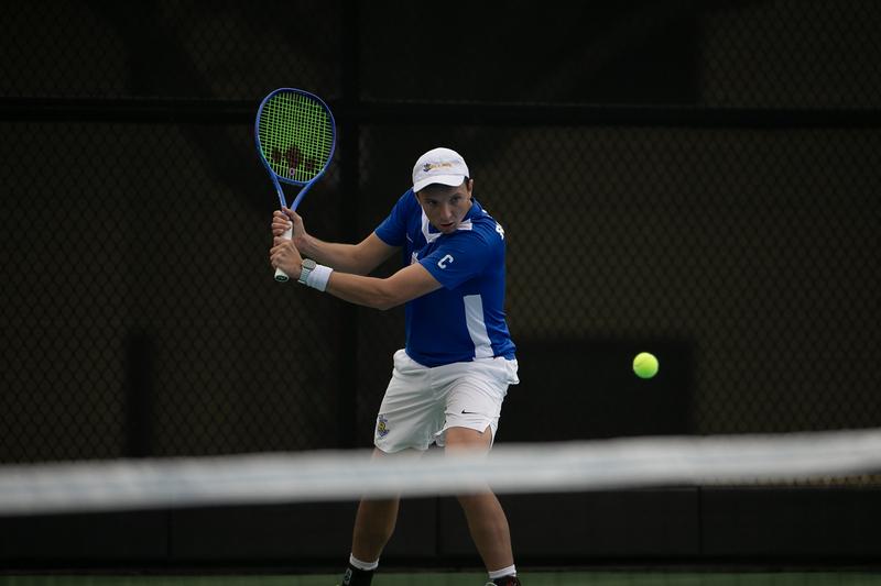 Nico De Giacomo hitting a backhand