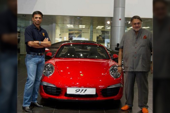 Rahul taking delivery of his Porsche car