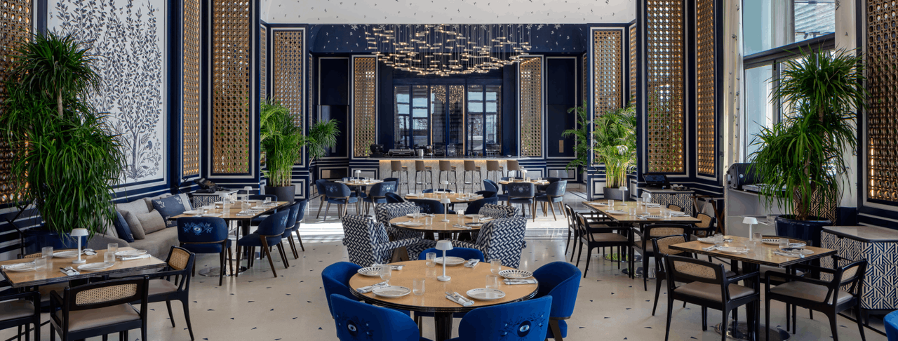 Interior of a modern restaurant dining room, representing restaurant construction services