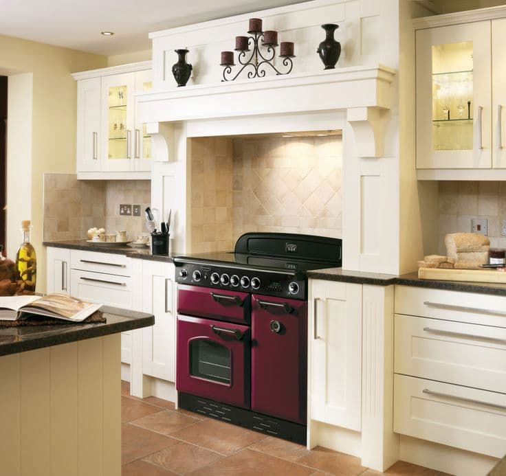 A red range cooker in a white kitchen. Nice.